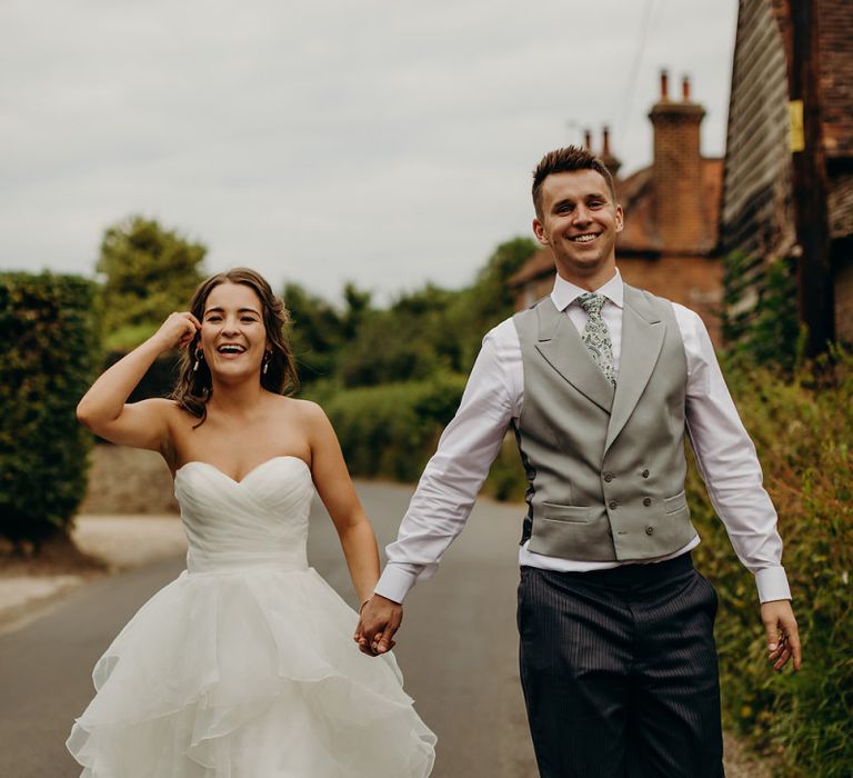 Bride wears strapless layered wedding dress