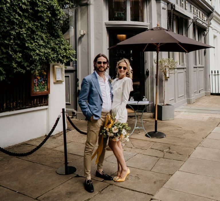 Bride and groom portrait outside The Phene pub