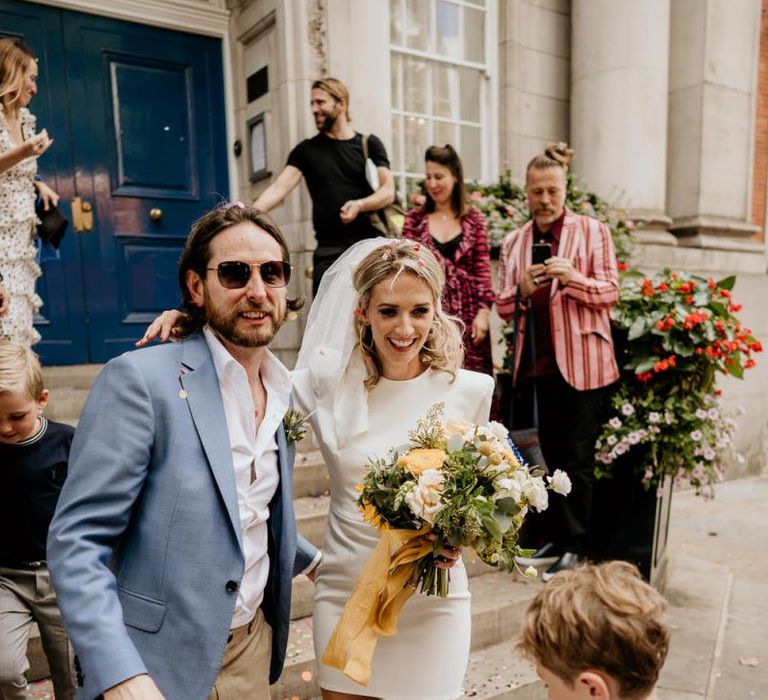 Stylish bride and groom at intimate London wedding