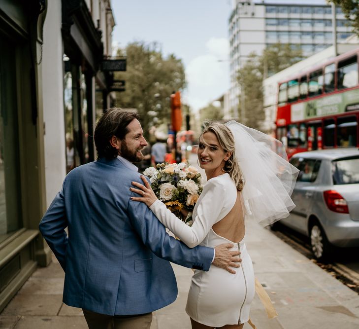 Bride in short wedding dress and veil