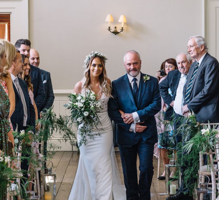 Wedding Ceremony Bridal Entrance with Bride in Fitted Mikaella Wedding Dress, Flower Crown and White and Green Wedding Bouquet