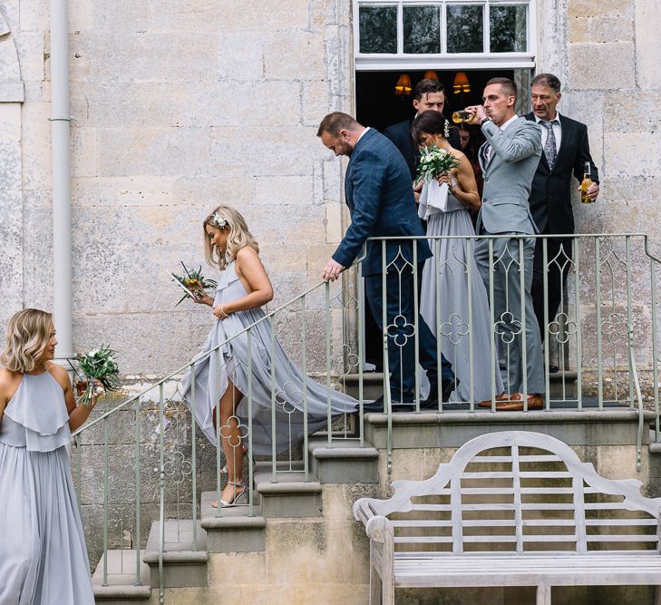 Wedding Party Exiting the Wedding Ceremony at Elmore Court Wedding Venue in Gloucestershire