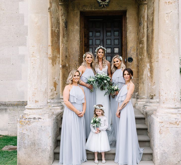 Bridal Party Portrait with Bride in Fitted Mikaella Wedding Dress and Bridesmaids in Sliver Mist TH&amp;TH Halterneck Dresses