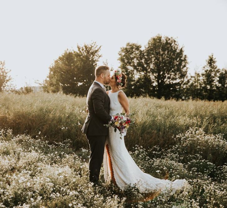 Grace Loves Lace wedding dress with bright bouquet