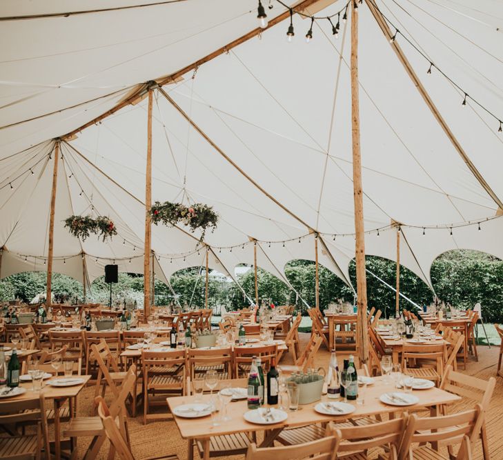 Marquee garden wedding for celebration with different bridesmaid dresses