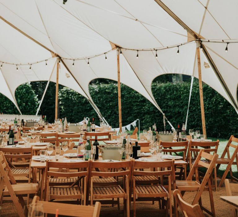 Festoon lighting in marquee wedding