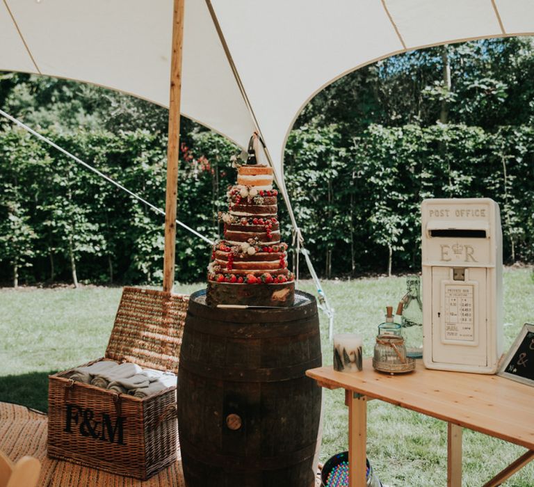 Naked wedding cake on barrel stand