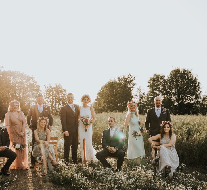 Bridal party in different bridesmaid dresses with hoop bouquets