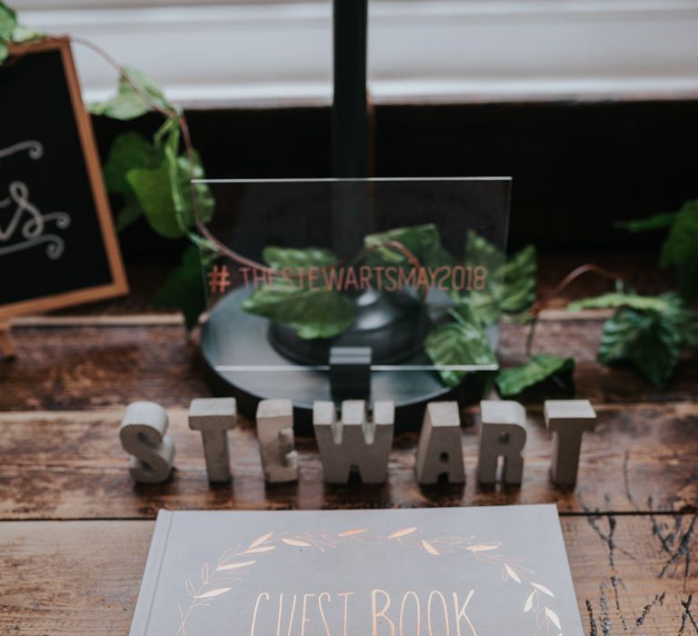 Copper Foil Wedding Guest Book | Pink Roll Top Booze Bath and Copper &amp; Perspex Wedding Decor at Industrial Venue The West Mill | Rosie Kelly Photography