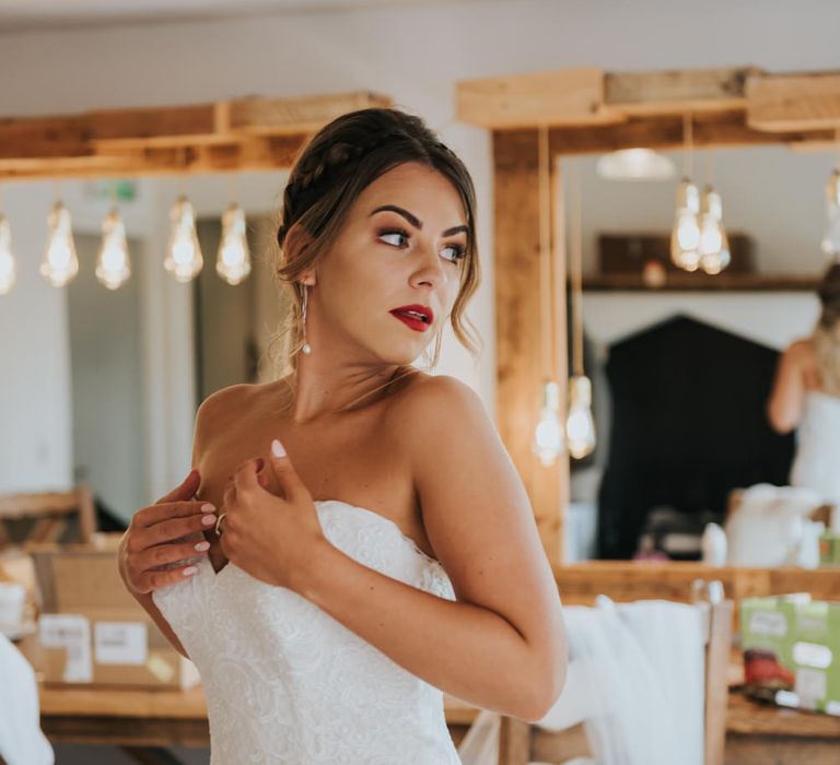 Beautiful Bride with Red Lipstick in Sweetheart Neckline Allure Wedding Dress | Pink Roll Top Booze Bath and Copper &amp; Perspex Wedding Decor at Industrial Venue The West Mill | Rosie Kelly Photography