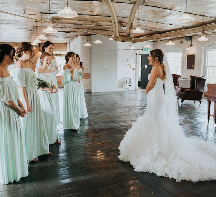 Bridal Party | Bride in Fishtail Allure Bridal Gown | Bridesmaids in Green off the Shoulder Sheln Dresses | Pink Roll Top Booze Bath and Copper &amp; Perspex Wedding Decor at Industrial Venue The West Mill | Rosie Kelly Photography