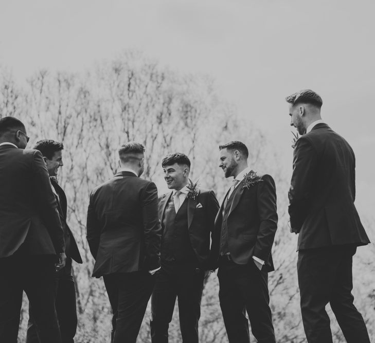 Groomsmen in Navy Ted Baker Suits from Moss Bros. | Pink Roll Top Booze Bath and Copper &amp; Perspex Wedding Decor at Industrial Venue The West Mill | Rosie Kelly Photography