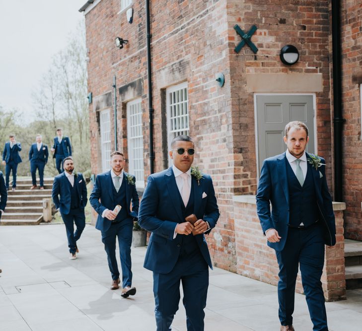 Groomsmen in Navy Ted Baker Suits from Moss Bros. | Pink Roll Top Booze Bath and Copper &amp; Perspex Wedding Decor at Industrial Venue The West Mill | Rosie Kelly Photography