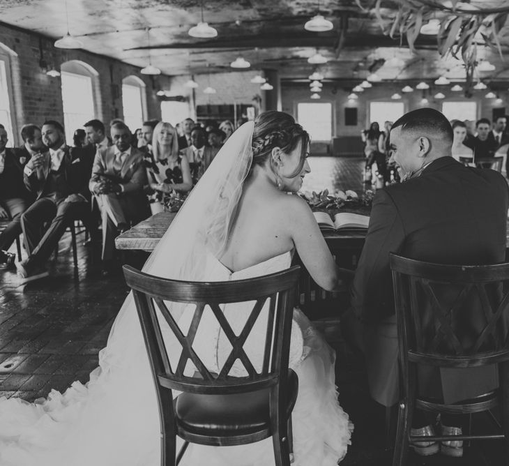 Wedding Ceremony | Bride in Fishtail Allure Bridal Gown | Groom in Navy Ted Baker Suit | Pink Roll Top Booze Bath and Copper &amp; Perspex Wedding Decor at Industrial Venue The West Mill | Rosie Kelly Photography