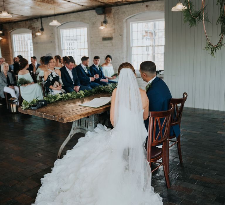 Wedding Ceremony | Bride in Fishtail Allure Bridal Gown | Groom in Navy Ted Baker Suit | Pink Roll Top Booze Bath and Copper &amp; Perspex Wedding Decor at Industrial Venue The West Mill | Rosie Kelly Photography