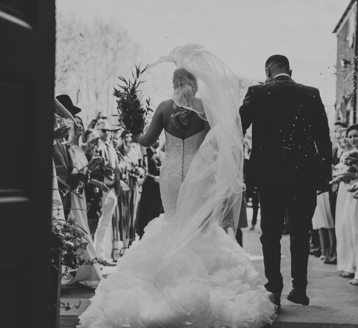 Bride in Fishtail Allure Bridal Gown | Groom in Navy Ted Baker Suit | Pink Roll Top Booze Bath and Copper &amp; Perspex Wedding Decor at Industrial Venue The West Mill | Rosie Kelly Photography