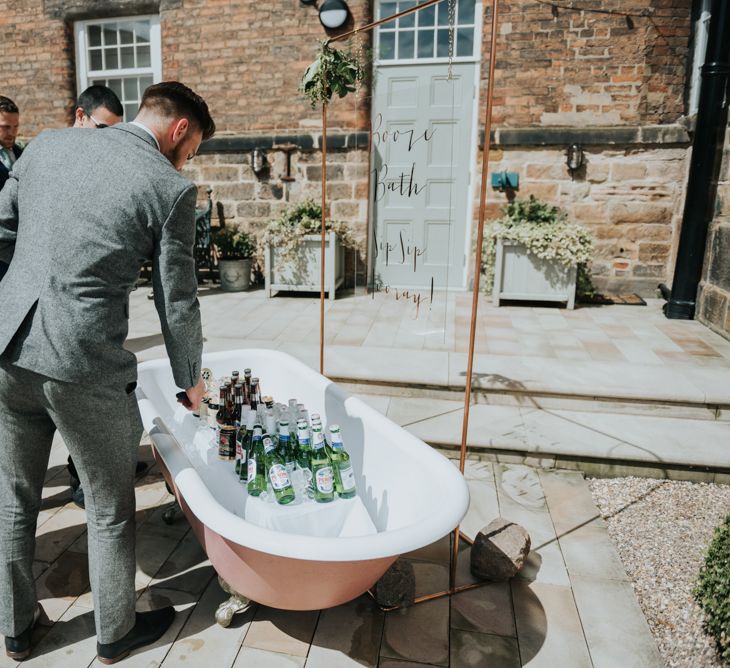 Pink Roll Top Booze Bath and Copper &amp; Perspex Wedding Sign | Industrial Venue The West Mill | Rosie Kelly Photography