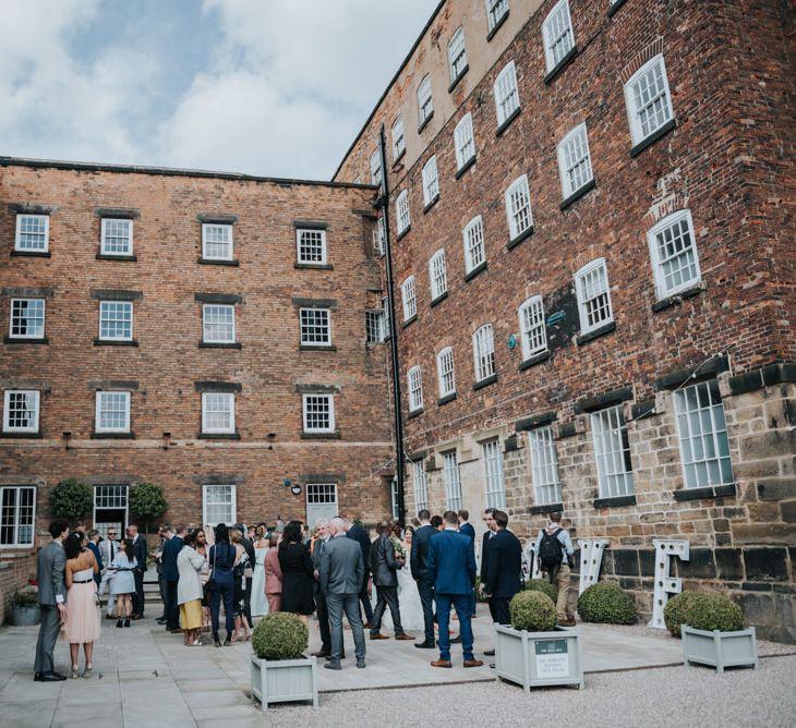 Pink Roll Top Booze Bath and Copper &amp; Perspex Wedding Decor at Industrial Venue The West Mill | Rosie Kelly Photography