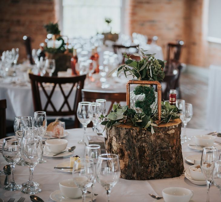 Tree Stump, Moss Cover Table Number &amp; Copper Frame Centrepiece | Pink Roll Top Booze Bath and Copper &amp; Perspex Wedding Decor at Industrial Venue The West Mill | Rosie Kelly Photography