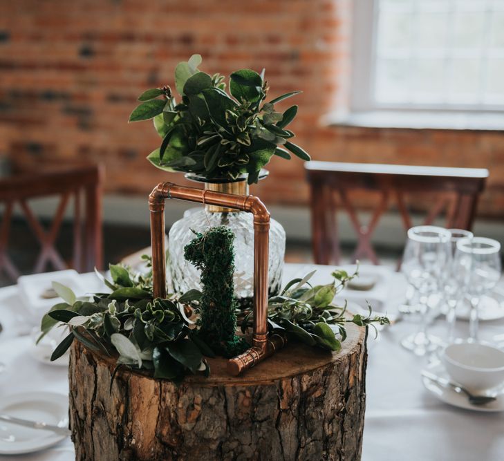 Tree Stump, Moss Cover Table Number &amp; Copper Frame Centrepiece | Pink Roll Top Booze Bath and Copper &amp; Perspex Wedding Decor at Industrial Venue The West Mill | Rosie Kelly Photography