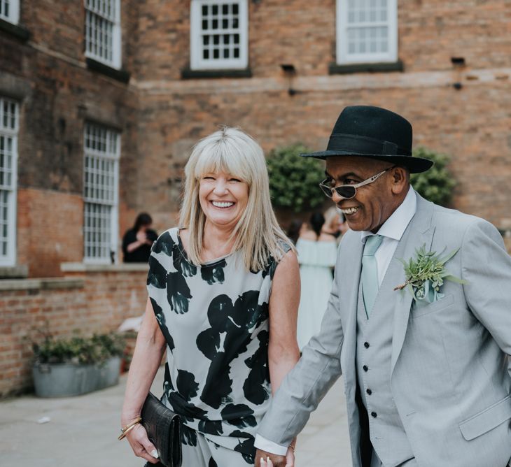 Wedding Guests | Pink Roll Top Booze Bath and Copper &amp; Perspex Wedding Decor at Industrial Venue The West Mill | Rosie Kelly Photography