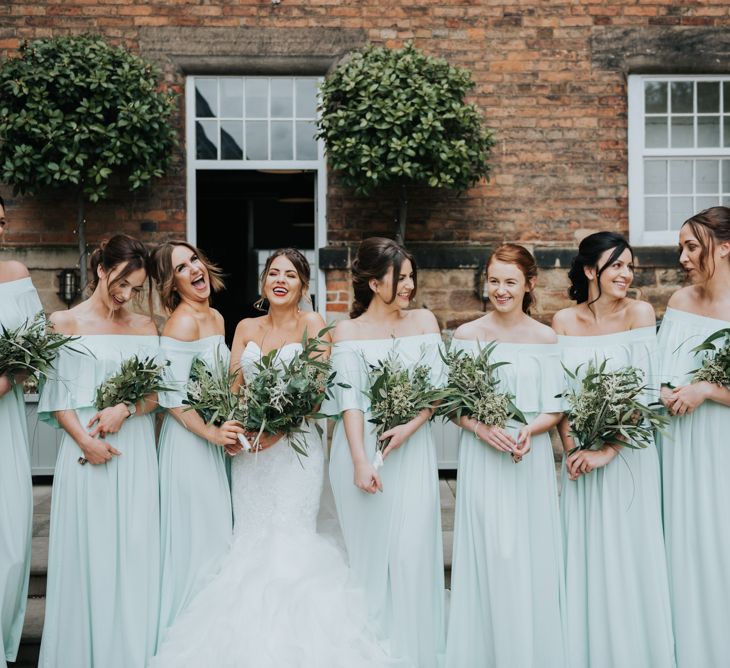 Bridal Party | Bridesmaids in Mint Green Bardot Dresses from Sheln | Bride in Fishtail Allure Bridal Gown | Pink Roll Top Booze Bath and Copper &amp; Perspex Wedding Decor at Industrial Venue The West Mill | Rosie Kelly Photography