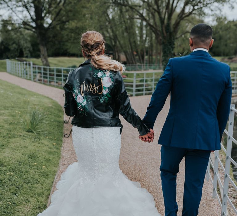 Customised Bridal Leather Jacket | Fishtail Allure Bridal Gown | Groom in Navy Ted Baker Suit | Pink Roll Top Booze Bath and Copper &amp; Perspex Wedding Decor at Industrial Venue The West Mill | Rosie Kelly Photography