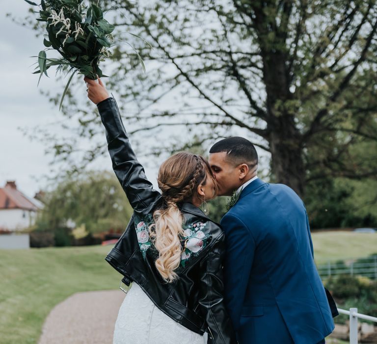 Customised Bridal Leather Jacket | Bridal Cover up | Fishtail Allure Bridal Gown | Groom in Navy Ted Baker Suit | Pink Roll Top Booze Bath and Copper &amp; Perspex Wedding Decor at Industrial Venue The West Mill | Rosie Kelly Photography