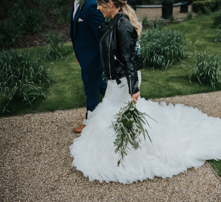 Greenery Bridal Bouquet | Customised Bridal Leather Jacket | Bridal Cover up | Fishtail Allure Bridal Gown | Groom in Navy Ted Baker Suit | Pink Roll Top Booze Bath and Copper &amp; Perspex Wedding Decor at Industrial Venue The West Mill | Rosie Kelly Photography