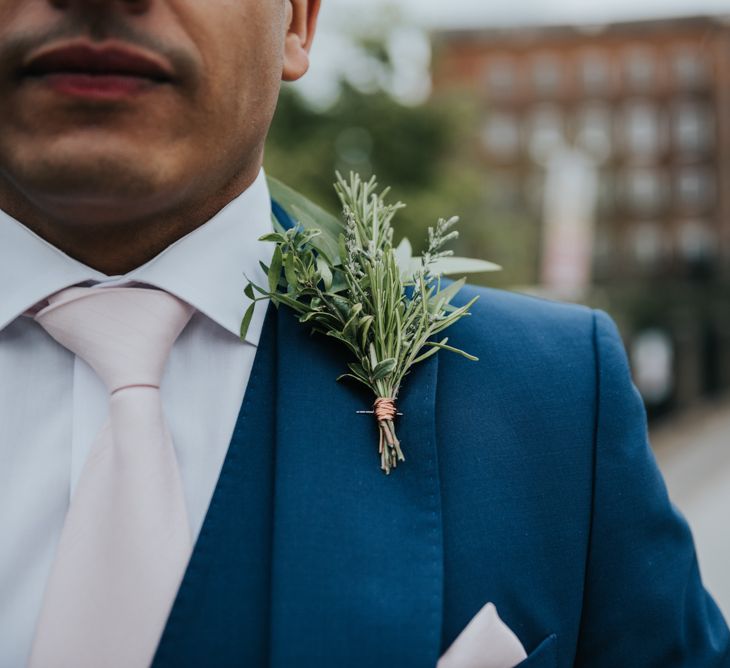 Greenery Buttonhole | Groom in Navy Ted Baker Suit | Pink Roll Top Booze Bath and Copper &amp; Perspex Wedding Decor at Industrial Venue The West Mill | Rosie Kelly Photography