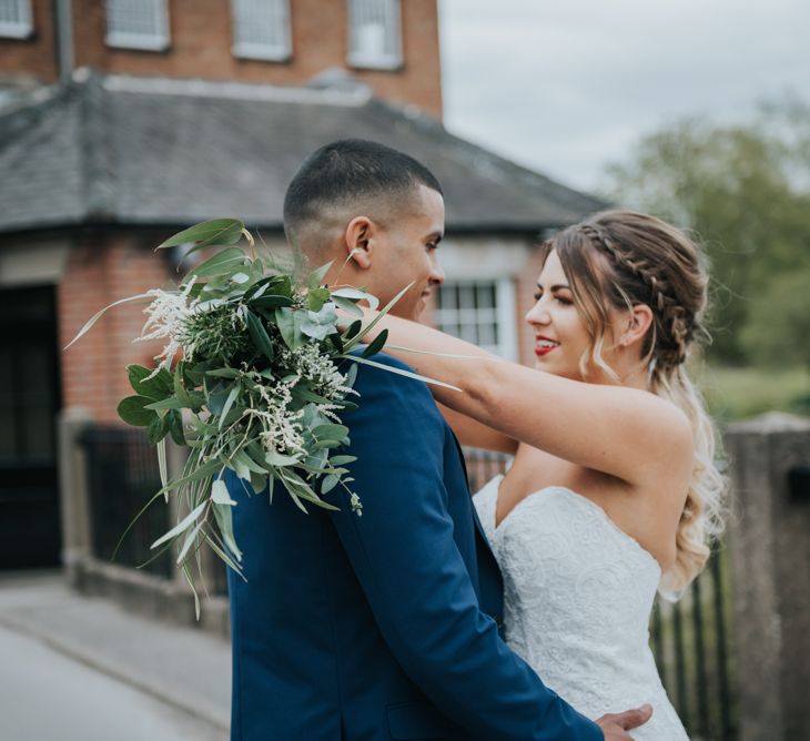 Bride in Fishtail Allure Bridal Gown | Groom in Navy Ted Baker Suit | Pink Roll Top Booze Bath and Copper &amp; Perspex Wedding Decor at Industrial Venue The West Mill | Rosie Kelly Photography