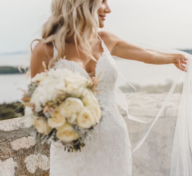 Essense of Australia wedding dress with white rose bouquet