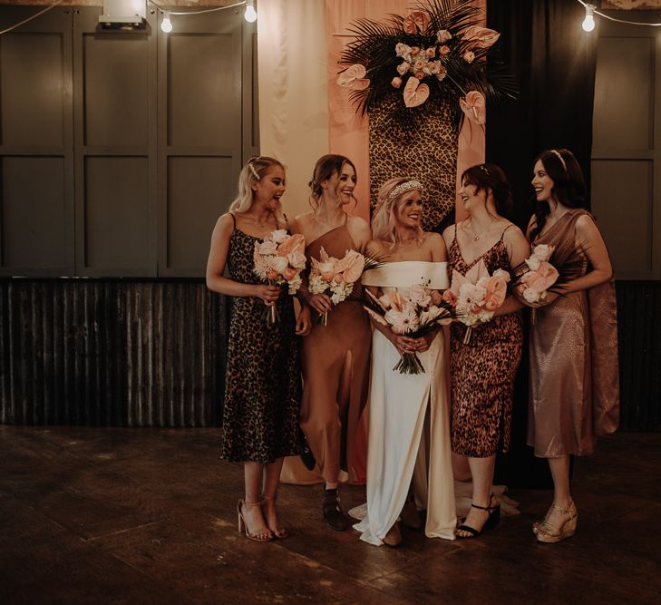 Bridal party portrait with bridesmaids in leopard print dresses