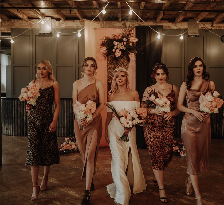 Bridesmaids in silk wedding dresses including leopard print dresses