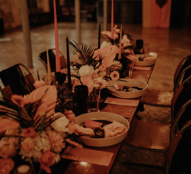 Intimate table scape with tropical flowers and candles