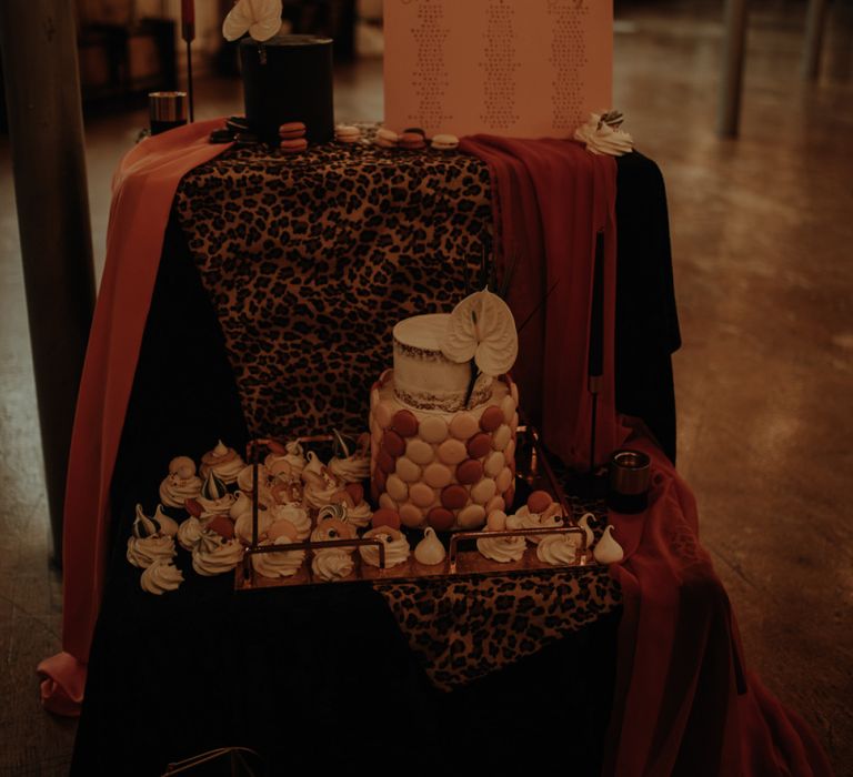 Dessert station and seating chart with leopard print cloth