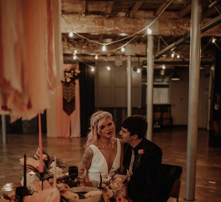 Stylish bride and groom at industrial wedding