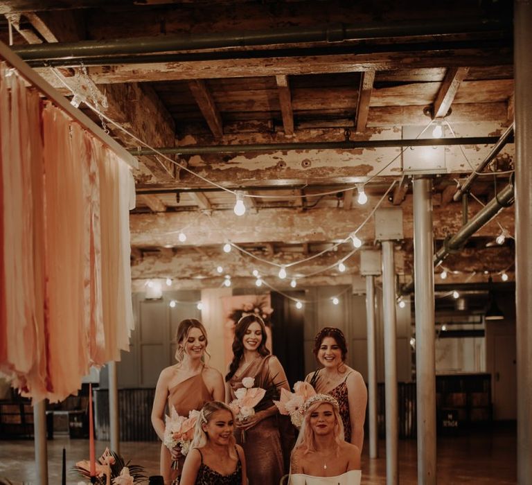 Industrial wedding with leopard print bridesmaid dresses