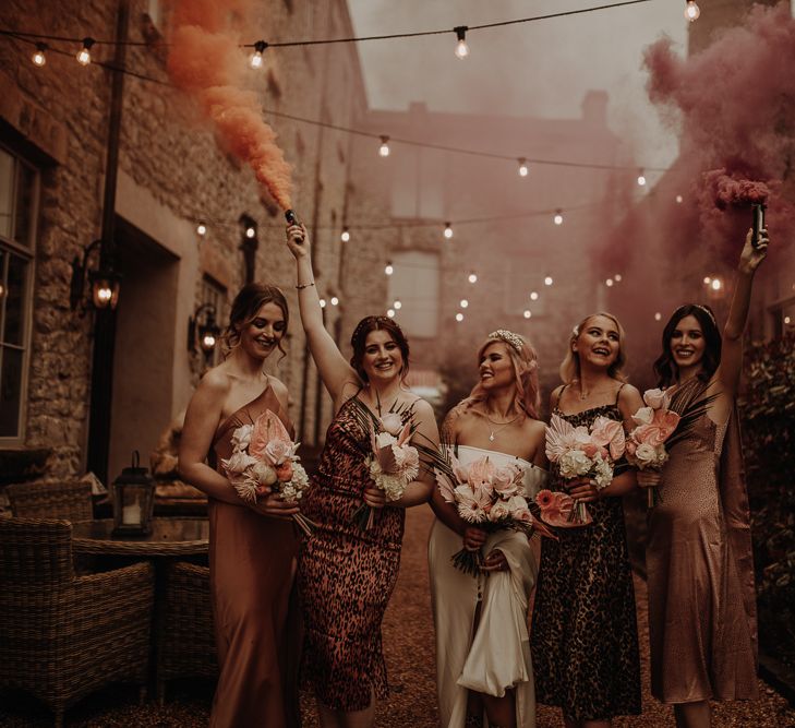 Wedding inspiration at Holmes Mill with festoon lights, smoke bombs and leopard print bridesmaid dresses