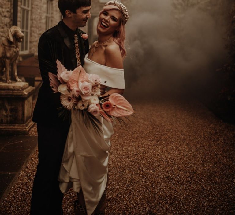 Bride and groom smoke bomb portrait with festoon lights at Holmes Mill