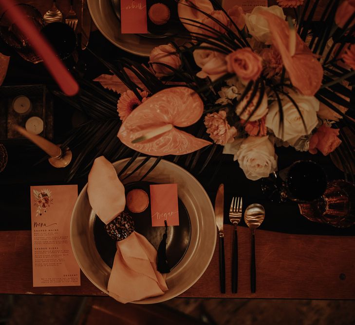 Table place setting with charger plate and menu card