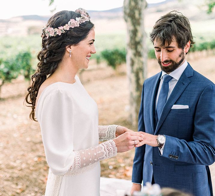 Bride and groom exchanging vows at the wedding ceremony