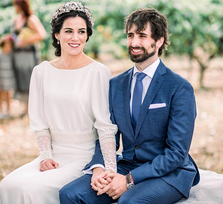 Bride in lace cuff sleeve wedding dress