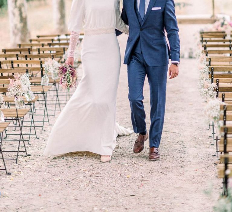 Bride and groom portrait holding an astilbe wedding bouquet