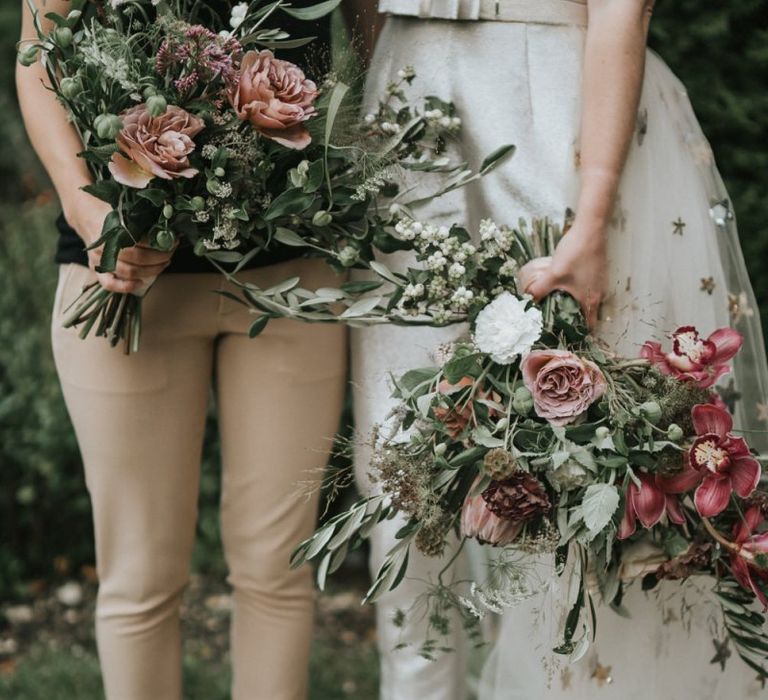 Two brides with complementing wedding bouquets