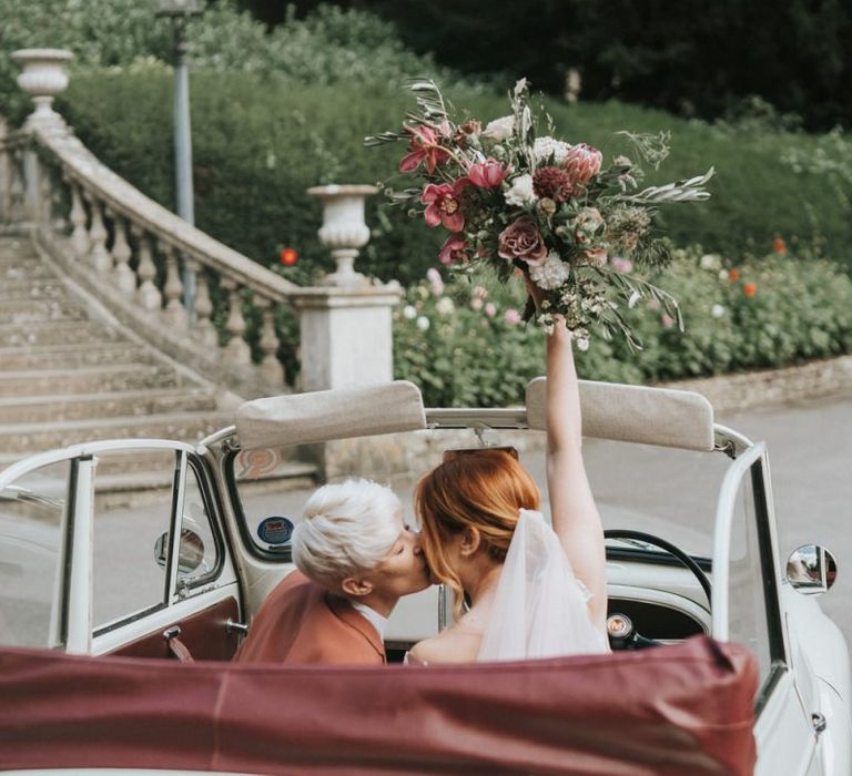 Brides in a wedding car for LGBTQ+ wedding inspiration