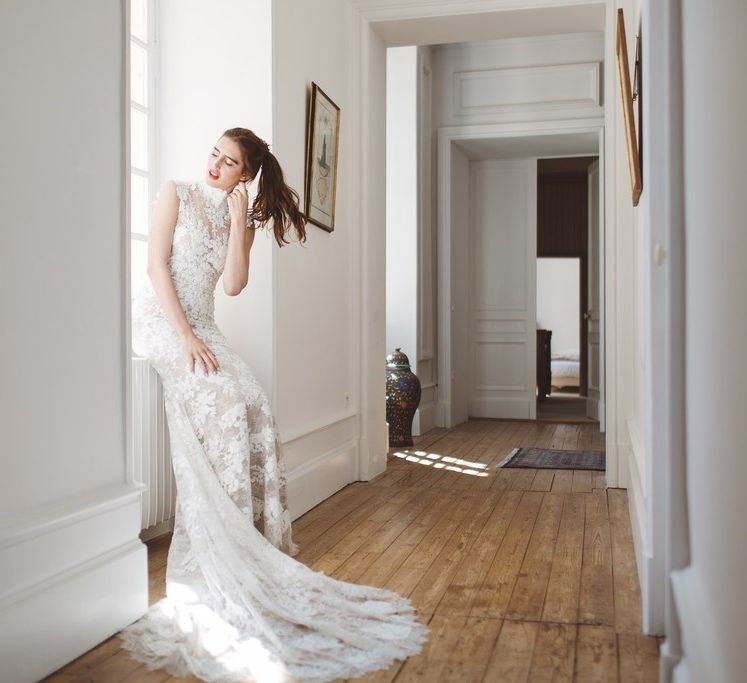 Pronovias Lace Wedding Dress with Puddle Train | L'heure Opulente - Laid Back French Chic, Paired with Elegant British Twists by Simply Pergord Weddings at Le Jardin à La Française Chateau | Mathilde Dufraisse Photography