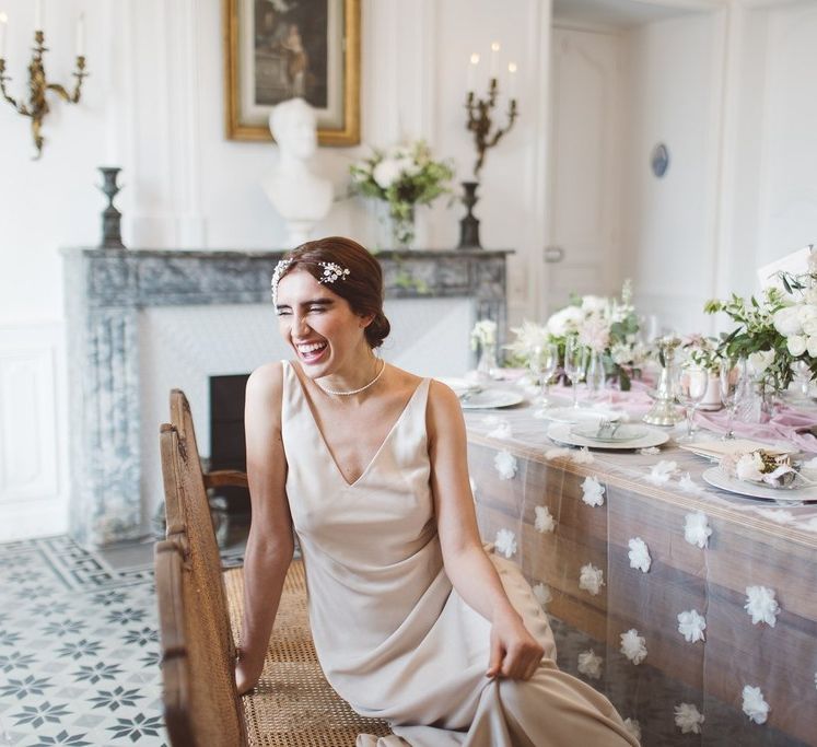 Charlie Brear Bridal Gown | Hermione Harbutt Headdress | L'heure Opulente - Laid Back French Chic, Paired with Elegant British Twists by Simply Pergord Weddings at Le Jardin à La Française Chateau | Mathilde Dufraisse Photography