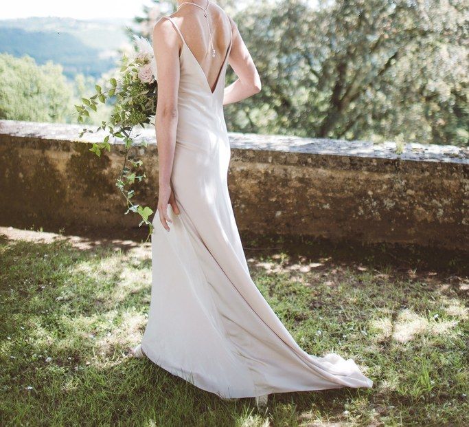 Charlie Brear Backlesss Bridal Gown | Hermione Harbutt Headdress | L'heure Opulente - Laid Back French Chic, Paired with Elegant British Twists by Simply Pergord Weddings at Le Jardin à La Française Chateau | Mathilde Dufraisse Photography