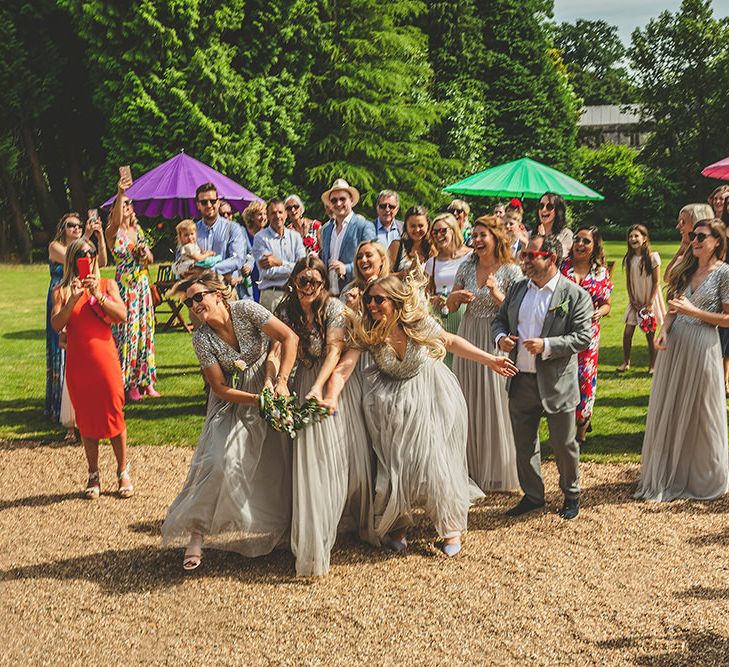 Bouquet Toss | Bridesmaids in Sequin &amp; Tulle Maya Dresses | Pennard House Outdoor Country Garden Wedding | Howell Jones Photography